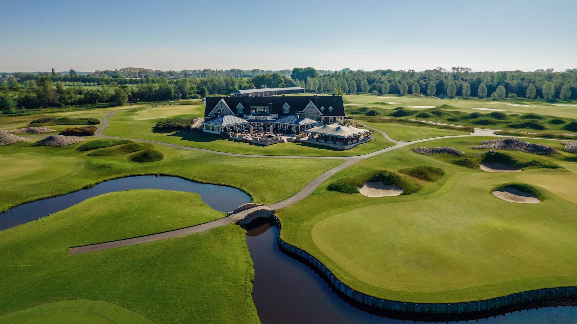 The Dutch clubhouse seen from above, across the water
